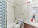 Sparkling full bathroom boasts shower-tub combo and sleek granite countertops for a clean and modern feel at 8361 S Upham Way # 209, Littleton, CO 80128