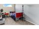 Snug bedroom offering a comfy bed, fan, and cool red locker-style furniture at 8361 S Upham Way # 209, Littleton, CO 80128