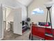 Cozy bedroom has a lofted ceiling, a fun fan, and a nice blue and red bed at 8361 S Upham Way # 209, Littleton, CO 80128