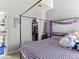 Neutral bedroom boasts a canopy bed and closet, perfect for a relaxing retreat at 8361 S Upham Way # 209, Littleton, CO 80128