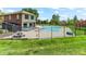 A community pool with lounge chairs and picnic tables, fenced in near the recreation center and lush grass at 8361 S Upham Way # 209, Littleton, CO 80128