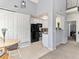 Dining area with table, next to kitchen and pantry storage at 8361 S Upham Way # 209, Littleton, CO 80128