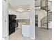 Modern kitchen featuring white cabinetry, stainless steel appliances, and granite countertops at 8361 S Upham Way # 209, Littleton, CO 80128