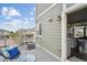 Cozy balcony view with outdoor seating, view of neighborhood and view into kitchen at 8095 E 128Th Pl, Thornton, CO 80602