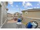 Outdoor balcony with chairs, a table, and view of surrounding neighborhood at 8095 E 128Th Pl, Thornton, CO 80602