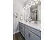 Elegant bathroom featuring double sinks, modern fixtures, and a decorative mirror at 8095 E 128Th Pl, Thornton, CO 80602