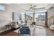 Inviting living room showcasing contemporary design, ample windows, and hardwood floors at 8095 E 128Th Pl, Thornton, CO 80602