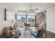 Spacious living room with hardwood floors, natural light, stylish furniture, and an open layout for versatile living and entertaining at 8095 E 128Th Pl, Thornton, CO 80602