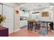 Finished basement craft room with work table and storage cabinets at 8115 Monte Vista Cir, Littleton, CO 80125