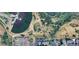 Aerial view showing the property in relation to baseball fields, a pond, and other houses at 2005 W 86Th Ave, Denver, CO 80260
