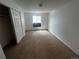 Bright bedroom features a closet, carpet and a window to let in natural light at 2005 W 86Th Ave, Denver, CO 80260