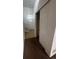 Entryway with tile flooring leading to stairs; features white walls, coat closet and front door at 2005 W 86Th Ave, Denver, CO 80260