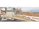 Residential gray-clad home with a two-car garage and an adjacent open field at 2005 W 86Th Ave, Denver, CO 80260