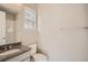 Bright bathroom featuring granite countertops, walk-in shower, and a toilet, perfect for daily routines at 2560 Wesley Ln, Lafayette, CO 80026