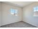 Comfortable bedroom with soft carpet and abundant natural light streaming through large windows at 2560 Wesley Ln, Lafayette, CO 80026