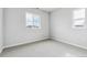 Well-lit bedroom with large windows, neutral walls, and plush carpeting at 2560 Wesley Ln, Lafayette, CO 80026