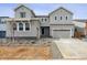 Charming two-story home features a two-car garage and lovely landscaping at 2560 Wesley Ln, Lafayette, CO 80026