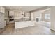 Beautiful kitchen with a center island, modern cabinets, and view into the adjacent living area at 2560 Wesley Ln, Lafayette, CO 80026