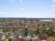 Expansive aerial view of a community near the mountains featuring homes, streets, and a view of the lake at 5497 W Prentice Ct, Littleton, CO 80123