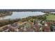 Picturesque aerial view of a neighborhood showcasing lush trees, tranquil ponds, and serene landscape at 5497 W Prentice Ct, Littleton, CO 80123