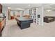 Finished basement with a game area, kitchenette, and cozy seating, perfect for entertaining at 5497 W Prentice Ct, Littleton, CO 80123