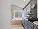 Bathroom featuring a soaker tub, shower, and a double vanity with lots of counter space at 5497 W Prentice Ct, Littleton, CO 80123