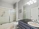 Bathroom with shower/tub combo and marble countertops at 5497 W Prentice Ct, Littleton, CO 80123