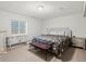 Bright bedroom with ample natural light, complemented by neutral tones and stylish furniture at 5497 W Prentice Ct, Littleton, CO 80123