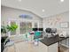 Bright home office features large windows, neutral carpet, and versatile layout at 5497 W Prentice Ct, Littleton, CO 80123