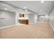 Finished basement featuring a wet bar area and spacious entertainment space at 6525 S Abilene St, Englewood, CO 80111