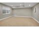 Spacious finished basement with recessed lighting and a window for natural light at 6525 S Abilene St, Englewood, CO 80111