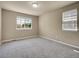 Neutral bedroom with a large window and a smaller window bringing in plenty of natural light at 6525 S Abilene St, Englewood, CO 80111