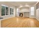 Bright and spacious living room with hardwood floors, fireplace, and large windows at 6525 S Abilene St, Englewood, CO 80111