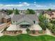 Aerial view of the backyard featuring a covered patio and beautifully landscaped grounds at 2840 Canyon Crest Ln, Highlands Ranch, CO 80126