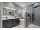 Beautiful bathroom featuring a double vanity, soaking tub, and modern shower with upgraded fixtures at 2840 Canyon Crest Ln, Highlands Ranch, CO 80126
