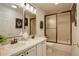 Traditional bathroom with double sinks and a shower/tub combo with a sliding glass door at 2840 Canyon Crest Ln, Highlands Ranch, CO 80126