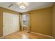 Cozy bedroom with hardwood floors, closet with sliding doors, and bright window at 2840 Canyon Crest Ln, Highlands Ranch, CO 80126