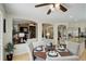 Bright dining area featuring an open layout to the living room and kitchen at 2840 Canyon Crest Ln, Highlands Ranch, CO 80126