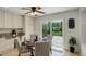 Cozy dining area with a table set for four and a sliding glass door leading to the backyard at 2840 Canyon Crest Ln, Highlands Ranch, CO 80126