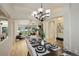Open concept view of the dining room into the living area at 2840 Canyon Crest Ln, Highlands Ranch, CO 80126