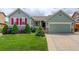 Charming home featuring a well-manicured lawn, red shutters, and beautiful landscaping at 2840 Canyon Crest Ln, Highlands Ranch, CO 80126