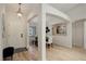 Inviting foyer with hardwood floors leading to dining area at 2840 Canyon Crest Ln, Highlands Ranch, CO 80126