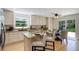 Bright kitchen featuring an island with seating, granite countertops, and stainless steel appliances at 2840 Canyon Crest Ln, Highlands Ranch, CO 80126