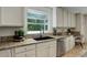 Well-lit kitchen features granite countertops, stainless steel appliances, and a garden window at 2840 Canyon Crest Ln, Highlands Ranch, CO 80126