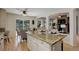 Spacious kitchen with granite countertops, a large island, and an open view to the living room at 2840 Canyon Crest Ln, Highlands Ranch, CO 80126