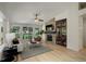 Spacious living room with fireplace, hardwood floors and backyard view at 2840 Canyon Crest Ln, Highlands Ranch, CO 80126