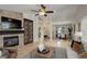 Open floor plan showing living room fireplace and dining area at 2840 Canyon Crest Ln, Highlands Ranch, CO 80126
