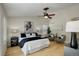 Tastefully decorated main bedroom with ample space, ceiling fan, and a tranquil ambiance at 2840 Canyon Crest Ln, Highlands Ranch, CO 80126