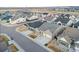 An aerial view showcases a neighborhood with neatly arranged homes and well-maintained lawns at 11412 Autumn Moon St, Littleton, CO 80125
