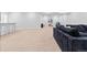 Basement recreational area with sofa, seating, and carpeted flooring at 11412 Autumn Moon St, Littleton, CO 80125